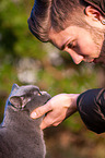 Man with British Shorthair