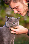 Man with British Shorthair