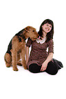 young woman with Airedale Terrier