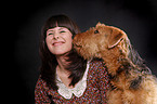 young woman with Airedale Terrier