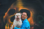 man and American Bulldog