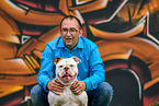 man and American Bulldog