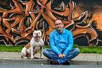 man and American Bulldog