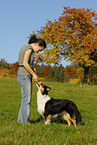 young woman with Australian Shepherd