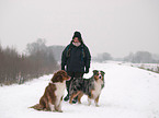 woman and Australian Shepherds