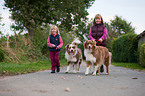 girls with Australian Shepherds