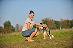 woman and Australian Shepherd