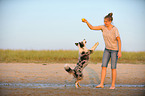 woman and Australian Shepherd