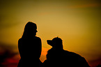 woman and Australian Shepherd