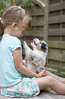 girl and Australian Shepherd Puppy