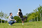 man with Australian Shepherd