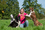 woman and 3 dogs