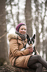 woman and Boston Terrier