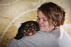 woman and Cavalier King Charles Spaniel