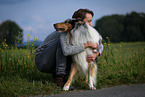 man and longhaired Collie