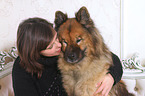 woman and Eurasian Dog