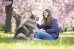 woman with Eurasian Dog