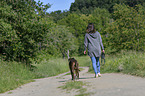 woman and German Boxer