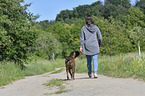 woman and German Boxer