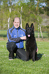 man and German Shepherd