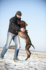 man and German shorthaired Pointer