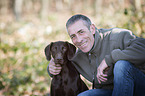 man and German shorthaired Pointer