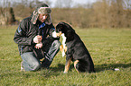 man and Greater Swiss Mountain Dog