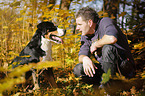 man and Greater Swiss Mountain Dog