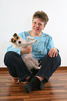 woman snuggles with Jack Russell Terrier