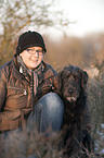 woman and Labradoodle