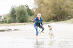 woman and Labradoodle