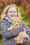 child with Lagotto Romagnolo Puppy