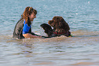 woman and Newfoundland Dog