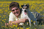 woman with Parson Russell Terrier in flower field