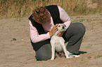 woman fondles Parson Russell Terrier