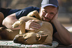 man with Rhodesian Ridgeback