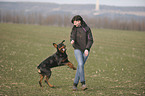 woman and Rottweiler