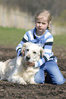 girl with golden retriever