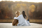 woman and Nova-Scotia-Duck-Tolling-Retriever-Cross