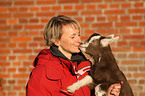 woman and young goat