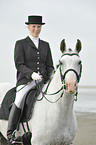 woman rides Andalusian horse