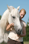 woman and Andalusian horse