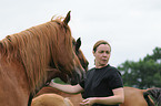 woman and arabian horses