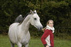 woman and arabian horse