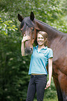 woman and english thoroughbred