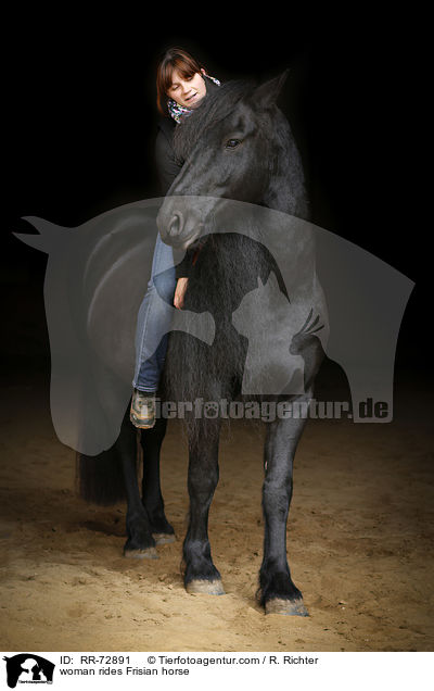 woman rides Frisian horse / RR-72891