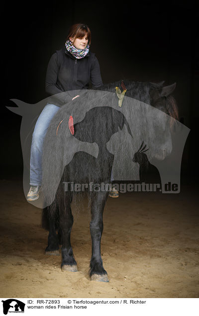 woman rides Frisian horse / RR-72893