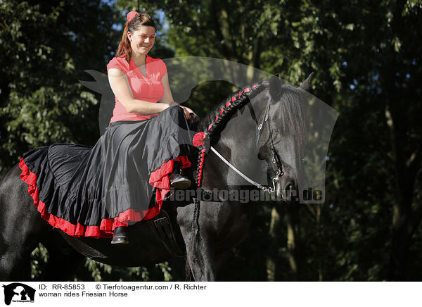 woman rides Friesian Horse / RR-85853