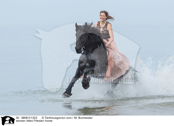 woman rides Friesian horse / MAB-01302