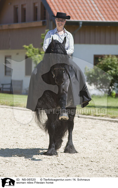 Frau reitet Friese / woman rides Friesian horse / NS-06520